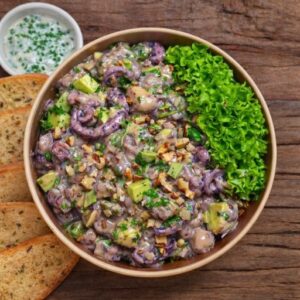 Pulpo al olivo con palta y pan, cocina marina a domicilio en Viña del Mar